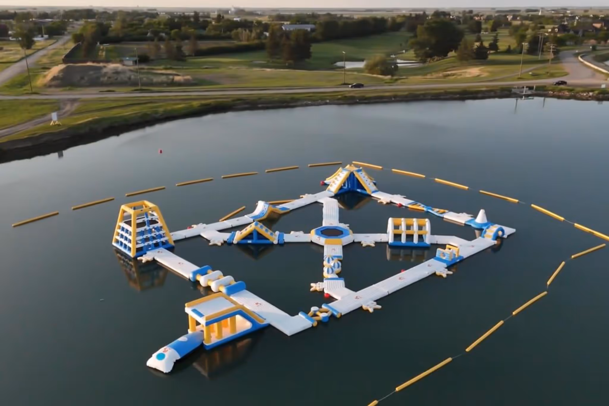 A BIG Alberta floating water park has a 15-foot-tall slide and climbing wall