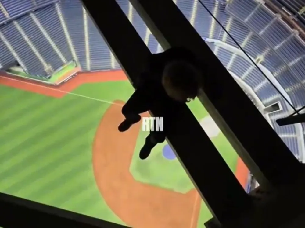 Daredevils caught on video hanging from Rogers Centre roof above field
