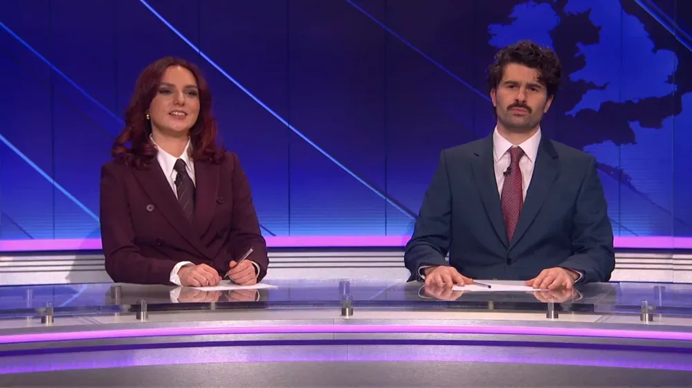 ‘SNL U.K.’ Weekend Update Takes Aim at Katy Perry’s Met Gala Mask, Which Symbolizes ‘What It’s Like To Live Life as a…