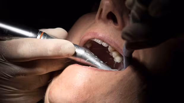 Man denied dental coverage under national plan says insurer 'playing games' with Canadians
