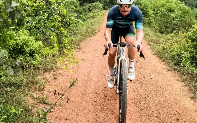 Why is F1 star Valtteri Bottas riding his bicycle from Malaysia to Singapore GP?