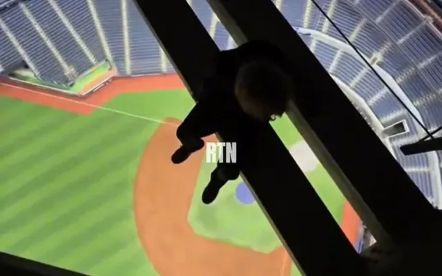 Daredevils caught on video hanging from Rogers Centre roof above field