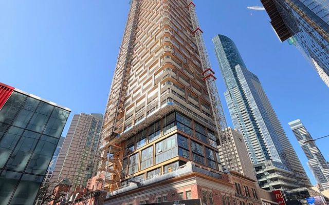 8 Elm Nears Final Floors as Bronze-Toned Cladding Climbs Higher