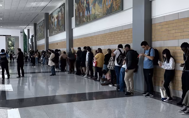 Thousands line up for CNE job fair as youth unemployment rate remains high