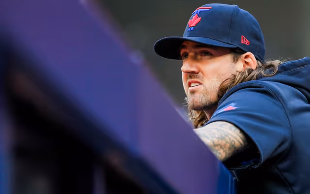 Kevin Gausman was on a flight from Toronto when the Blue Jays traded him