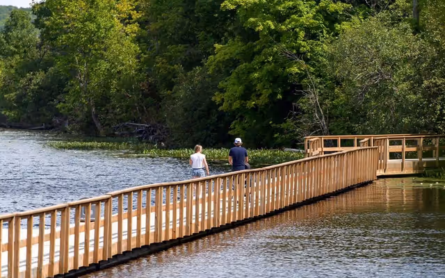 You can walk on a floating boardwalk in Ontario that follows a winding river